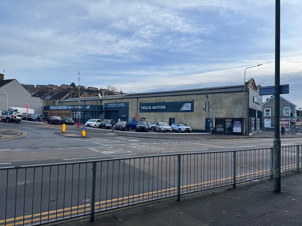 Lot: 82 - FREEHOLD CAR SALES SITE, SHOWROOM & WORKSHOP WITH REDEVELOPMENT POTENTIAL. - Side view from Crabble Hill